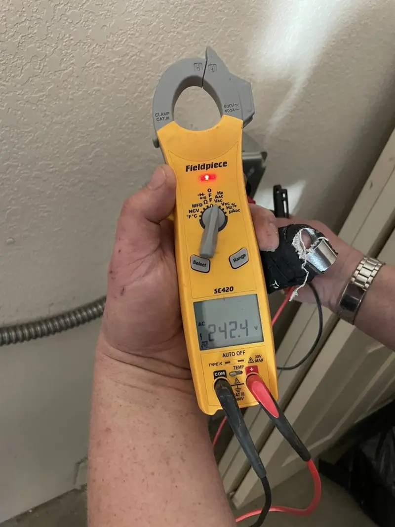 Voltage testing with clamp meter during Recessed Lighting Installation in Stanton